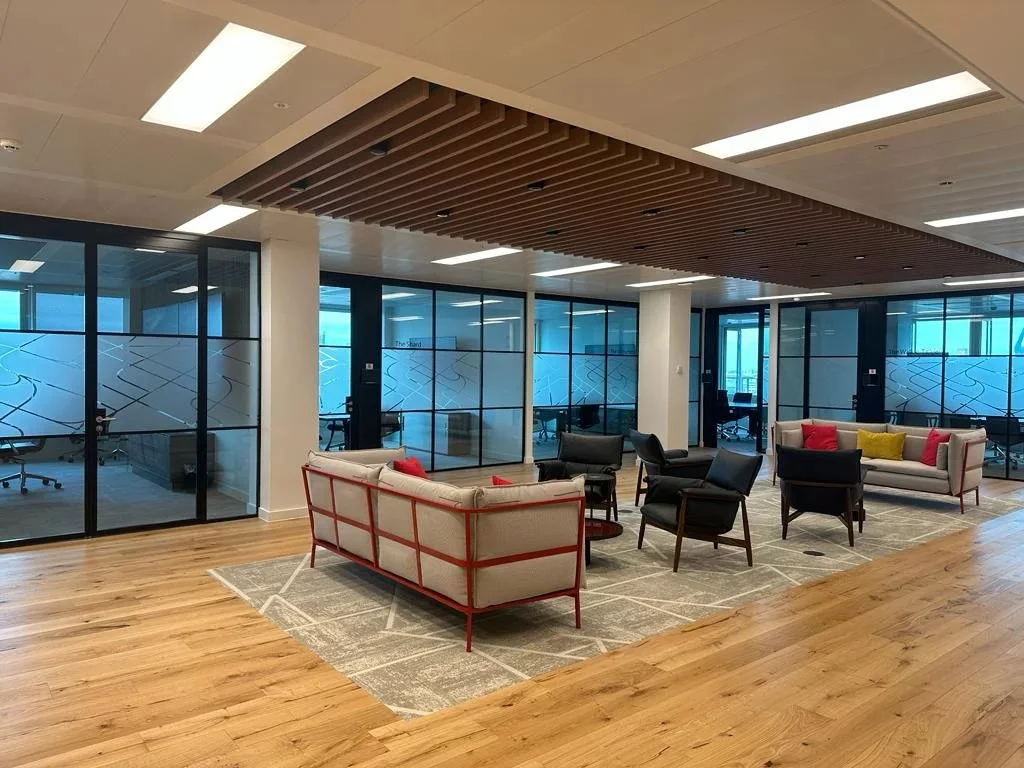 interior of office with seating and glass partitions